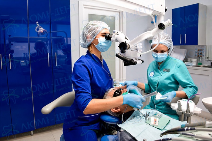 The treatment process under computer anesthesia in Lumi-Dent Anesthesia in dentistry treatment of teeth without pain Kiev Lumi-Dent